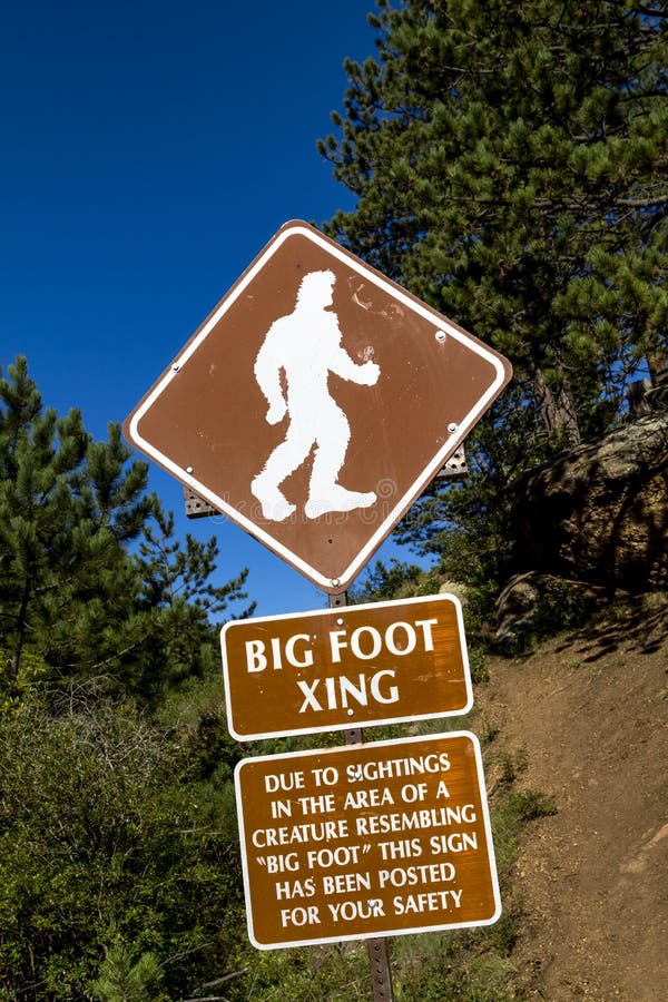 Big foot crossing sign with warning about sightings in the area. Big foot crossing sign with warning about sightings in the area