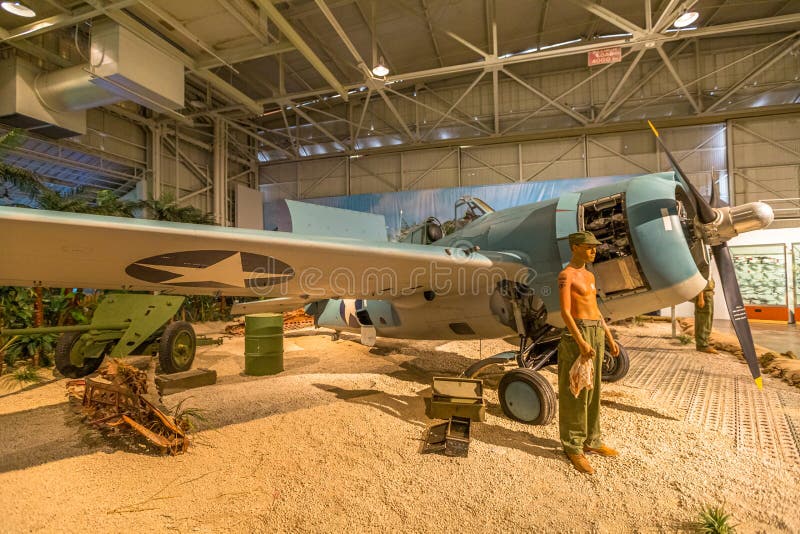 Honolulu, Oahu, Hawaii, United States -August 2016: American Marine pilot with Grumman F4F-3 Wildcat Fighter of 1942 in Hangar 37 of the Pearl Harbor Museum of Hawaii. American aircraft in World War 2. Honolulu, Oahu, Hawaii, United States -August 2016: American Marine pilot with Grumman F4F-3 Wildcat Fighter of 1942 in Hangar 37 of the Pearl Harbor Museum of Hawaii. American aircraft in World War 2