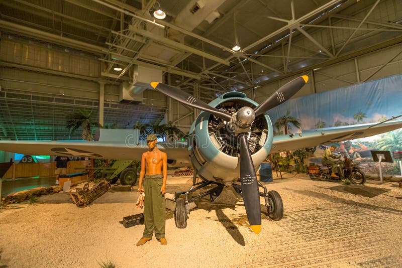 Honolulu, Oahu, Hawaii, United States -August 2016: American Marine pilot with Grumman F4F-3 Wildcat Fighter of 1942 in Hangar 37 of the Pearl Harbor Museum of Hawaii. American aircraft in World War 2. Honolulu, Oahu, Hawaii, United States -August 2016: American Marine pilot with Grumman F4F-3 Wildcat Fighter of 1942 in Hangar 37 of the Pearl Harbor Museum of Hawaii. American aircraft in World War 2