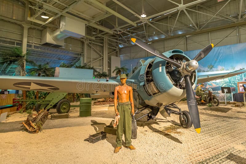 Honolulu, Oahu, Hawaii, United States -August 2016: American Marine pilot with Grumman F4F-3 Wildcat Fighter of 1942 in Hangar 37 of the Pearl Harbor Museum of Hawaii. American aircraft in World War 2. Honolulu, Oahu, Hawaii, United States -August 2016: American Marine pilot with Grumman F4F-3 Wildcat Fighter of 1942 in Hangar 37 of the Pearl Harbor Museum of Hawaii. American aircraft in World War 2