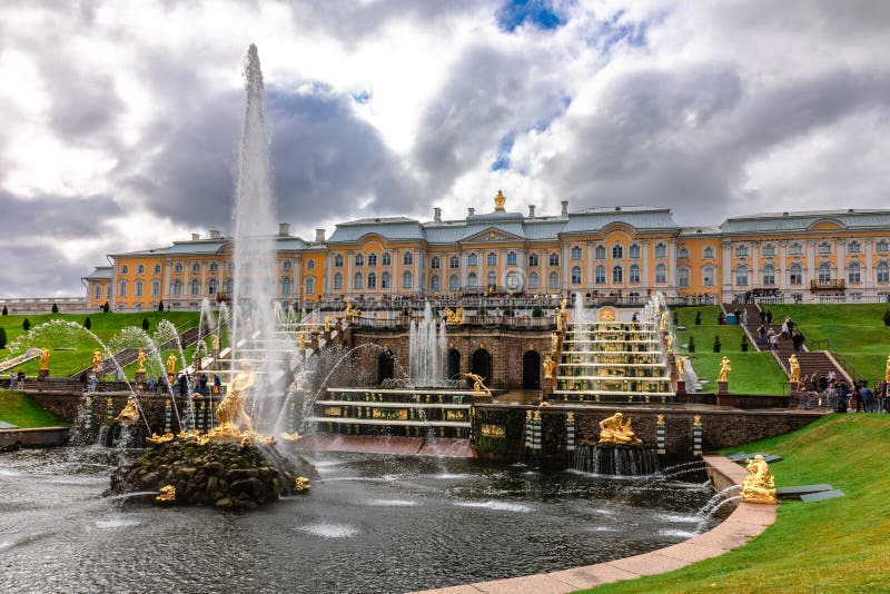 St. Petersburg, Russia - August 23, 2023: Fountains of Peterhof. Golden statues of Grand Cascade and Samson Fountain at Peterhof Palace. St. Petersburg, Russia - August 23, 2023: Fountains of Peterhof. Golden statues of Grand Cascade and Samson Fountain at Peterhof Palace.