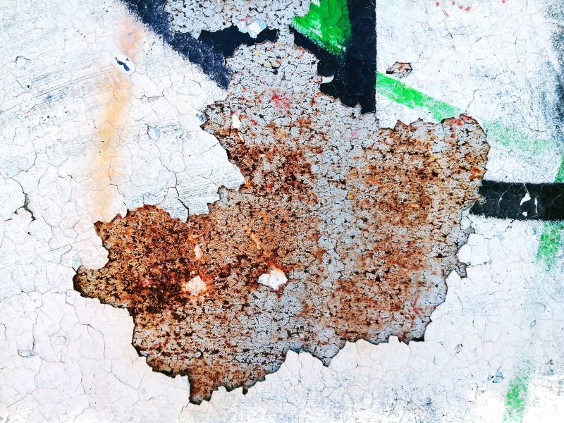 Grunge colorful background, peeling paint texture, cracks on concrete, rust on metal, aged grafitti royalty free stock photography