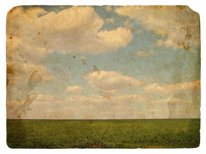 Grunge image of a field and sky with clouds