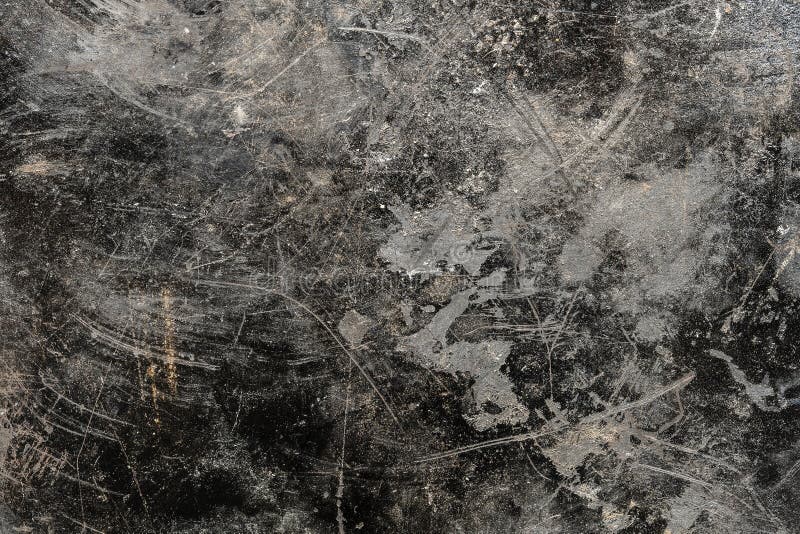 Grunge old black metal background or texture with scratches and cracks, close up, top view. Grunge old black metal background or texture with scratches and cracks, close up, top view