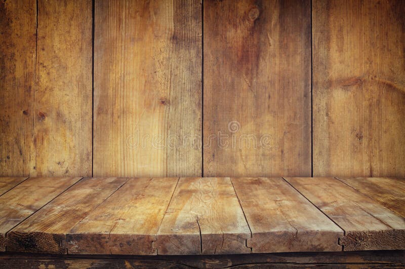 Grunge Vintage Wooden Board Table in Front of Old Wooden