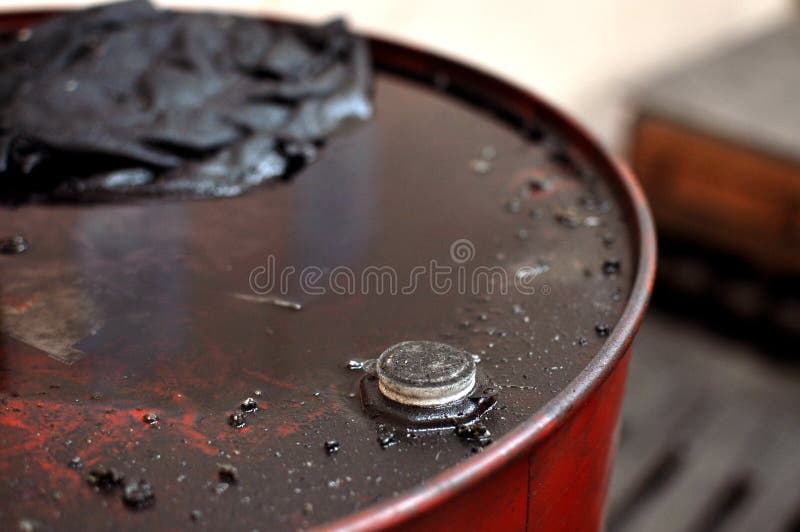 Close up grungy oil drum in factory. Close up grungy oil drum in factory