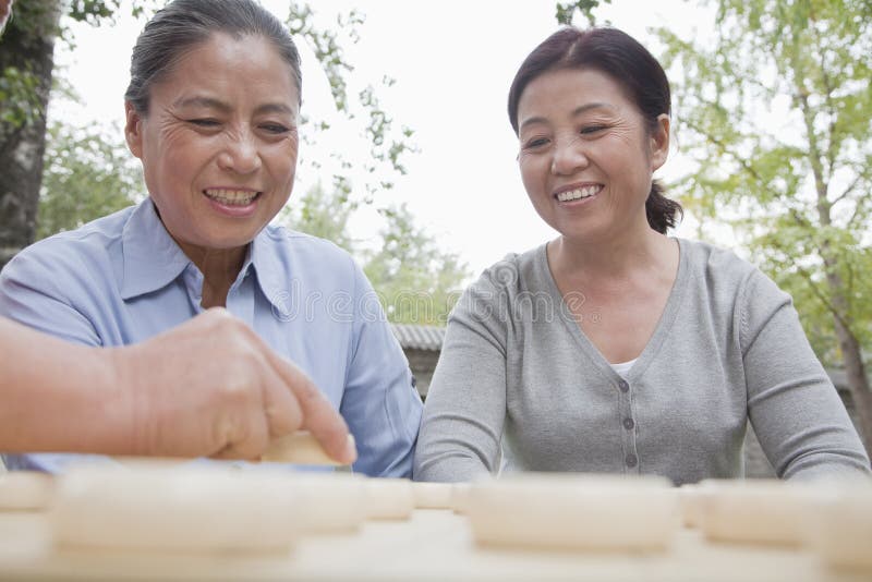 Group of mature women playing Chinese checkers. Group of mature women playing Chinese checkers