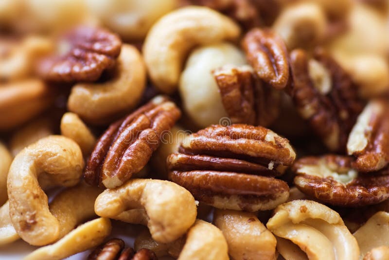 Group of mixed roasted nuts lying on a pile. Group of mixed roasted nuts lying on a pile