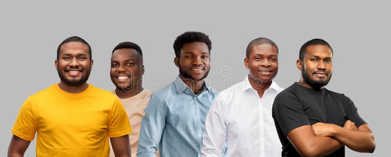 Race, ethnicity and people concept - group of happy smiling young african american men over grey background. Race, ethnicity and people concept - group of happy smiling young african american men over grey background