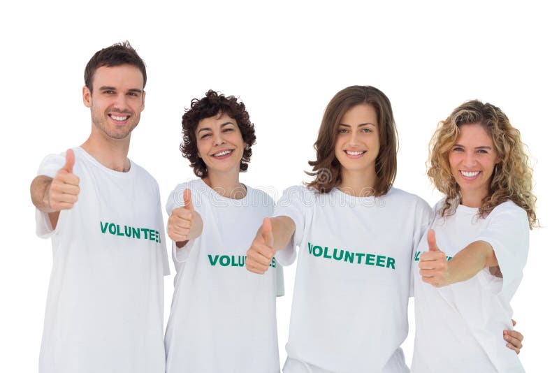 Grupo alegre de voluntários que dão thums acima fotografia de stock Grupo alegre de voluntários que dão thums acima fotografia de stock