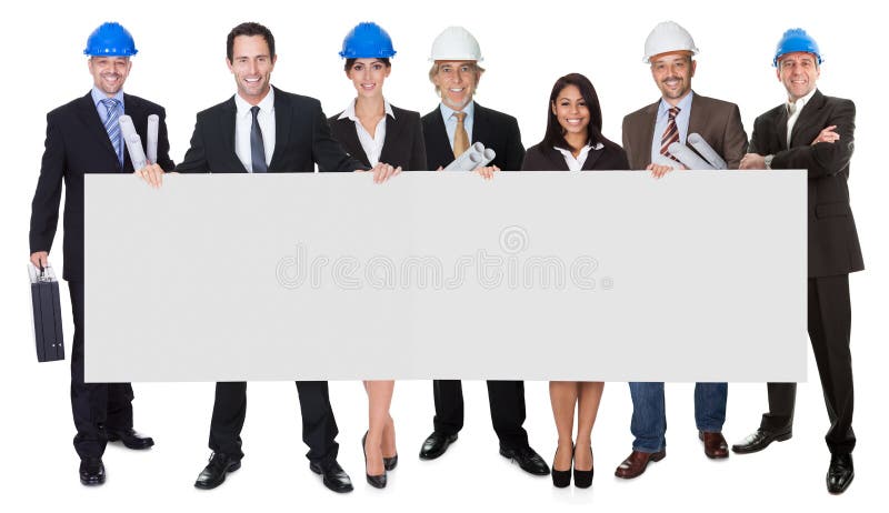 Grupo de arquitectos que presentan la bandera vacía imagen de archivo Grupo de arquitectos que presentan la bandera vacía imagen de archivo