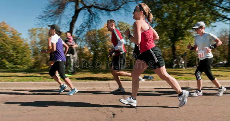 MINNEAPOLIS, MN - OCTOBER 3: Group of runners run up the hill of Mile 19 of the 2010 Medtronic Twin Cities Marathon, October 3, 2010 in Minneapolis, Minnesota. MINNEAPOLIS, MN - OCTOBER 3: Group of runners run up the hill of Mile 19 of the 2010 Medtronic Twin Cities Marathon, October 3, 2010 in Minneapolis, Minnesota