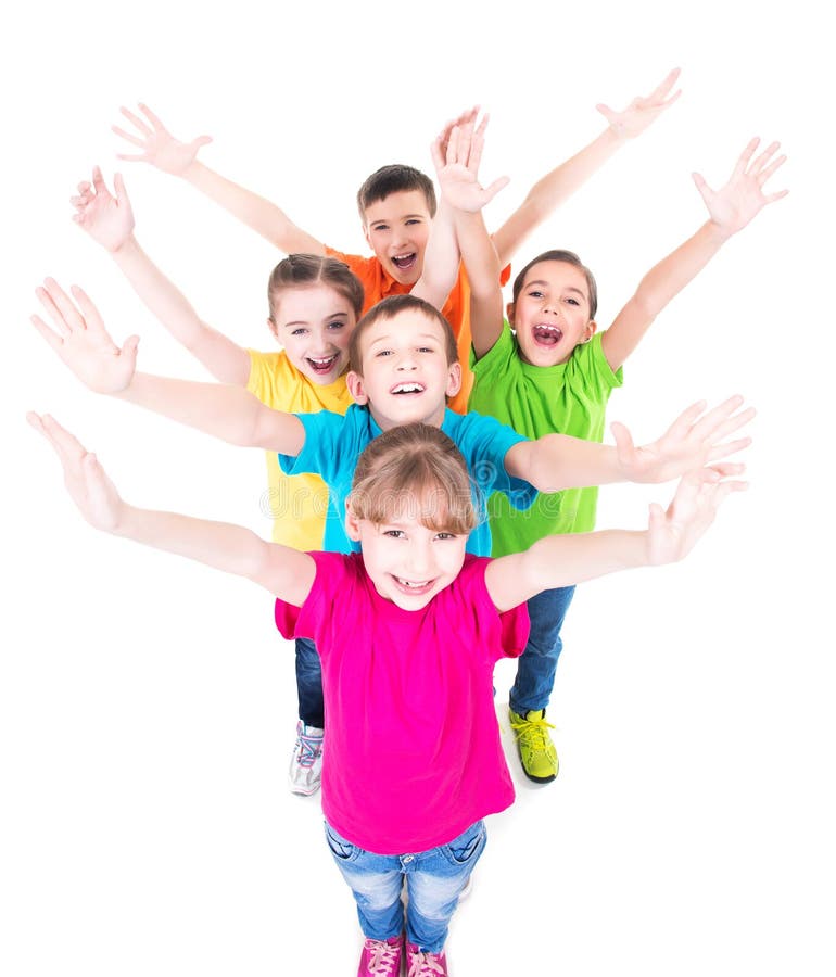 Group of smiling children with raised hands in colorful t-shirts standing together. Top view. Isolated on white. Group of smiling children with raised hands in colorful t-shirts standing together. Top view. Isolated on white.