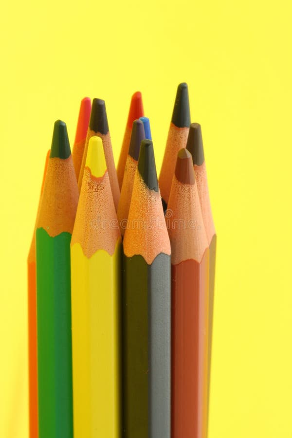 Bunch of colorful pencils on yellow background. Bunch of colorful pencils on yellow background