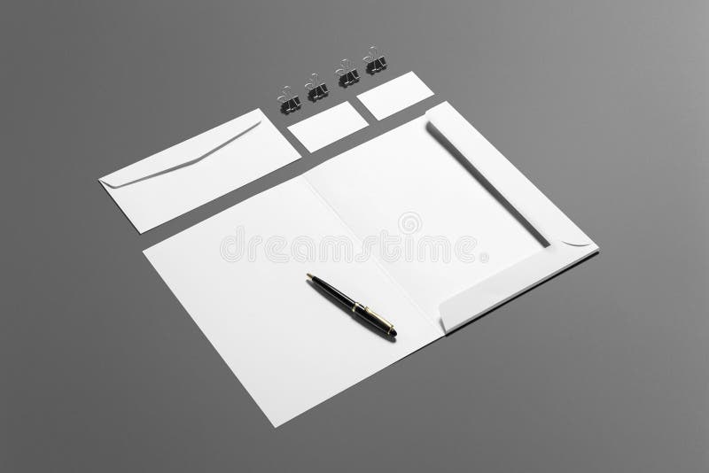 Grupo de marcagem com ferro quente dos artigos de papelaria vazios isolado no fundo cinzento, lugar com seu projeto fotografia de stock royalty free Grupo de marcagem com ferro quente dos artigos de papelaria vazios isolado no fundo cinzento, lugar com seu projeto fotografia de stock royalty free