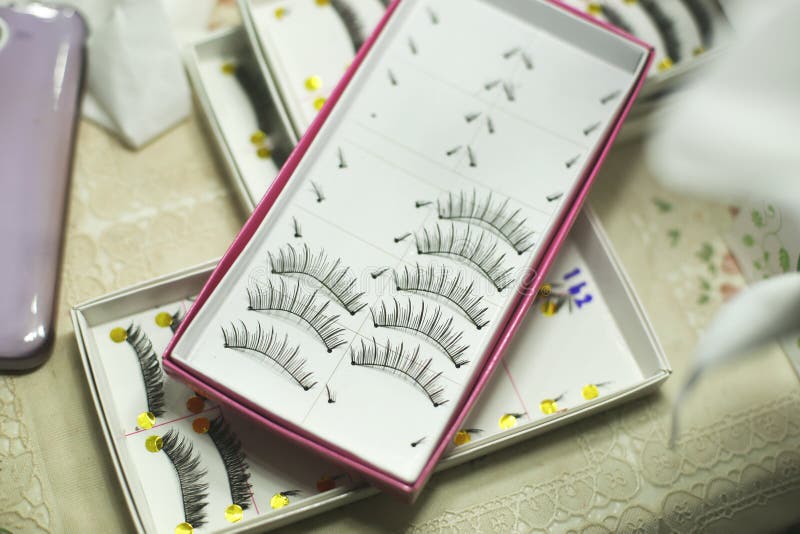 Set of false eyelashes in box for makeup on the table. Set of false eyelashes in box for makeup on the table