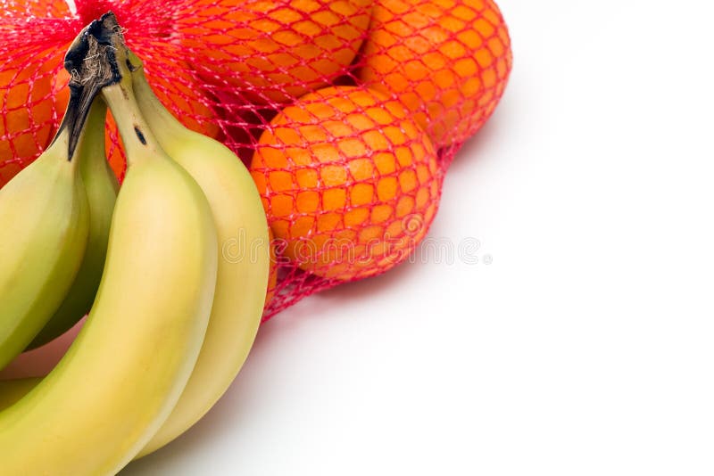 Grupos das laranjas e das bananas imagem de stock Grupos das laranjas e das bananas imagem de stock