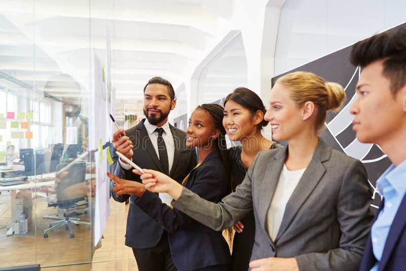 Group of business people in consulting workshop planning together. Group of business people in consulting workshop planning together