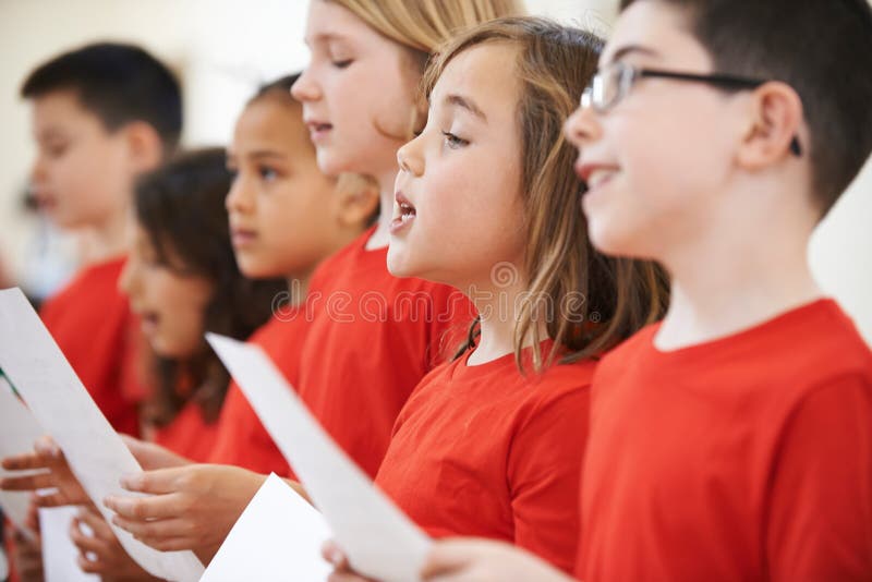 Group Of School Children Sing In Choir Together. Group Of School Children Sing In Choir Together