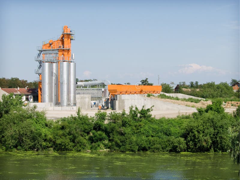 Asphalt factories along the river. Asphalt factories along the river