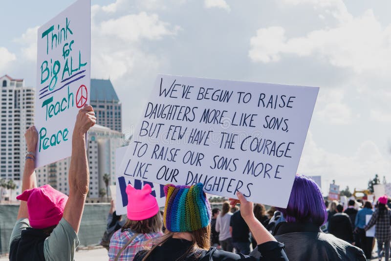 Group of women protesting in the 2018 Women`s Impeachment March with signs about equality and peace. Group of women protesting in the 2018 Women`s Impeachment March with signs about equality and peace