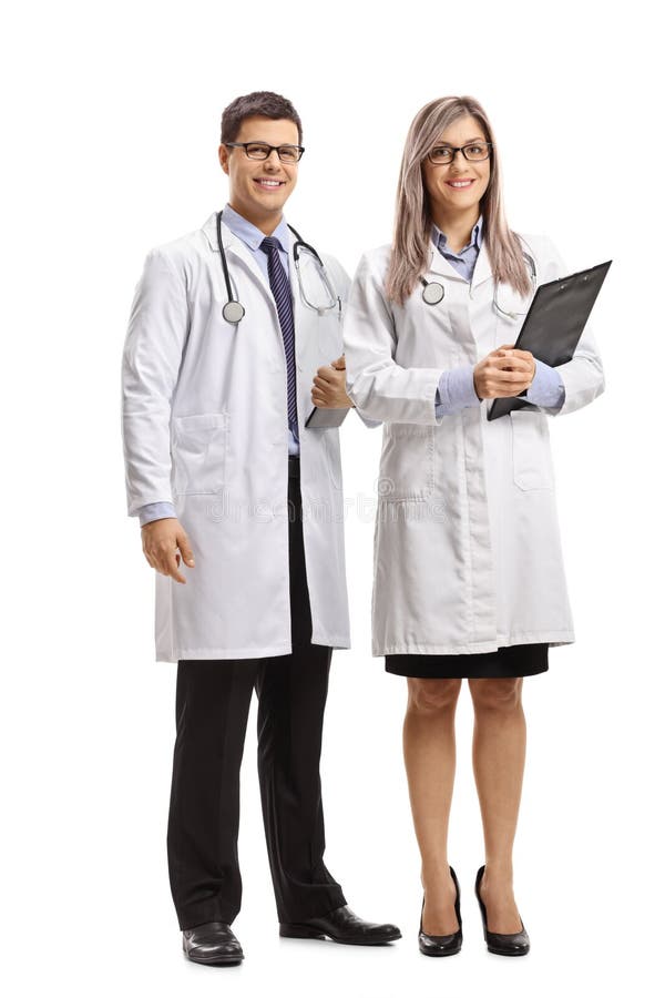 Gruppo di medico maschio e femminile che sorride alla macchina fotografica fotografie stock libere da diritti Gruppo di medico maschio e femminile che sorride alla macchina fotografica fotografie stock libere da diritti