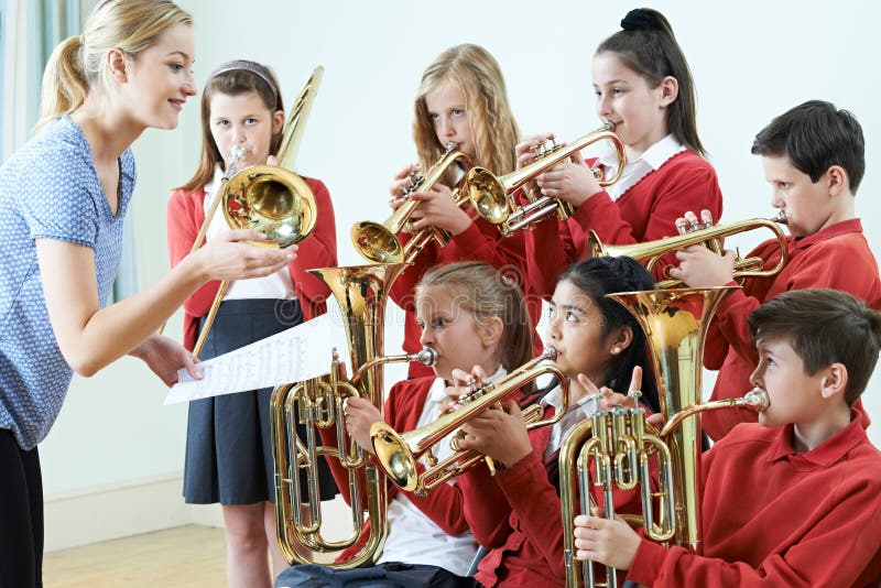 Students Playing In School Orchestra Together. Students Playing In School Orchestra Together