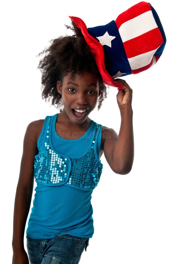Little african american girl playing with american cap very happy. Little african american girl playing with american cap very happy.