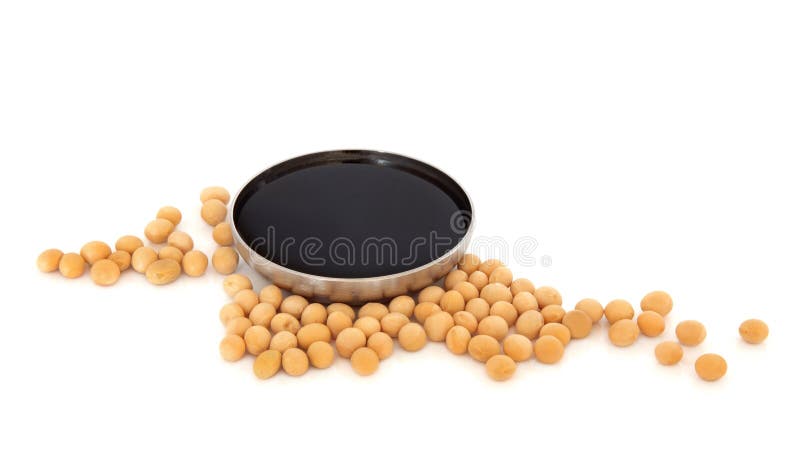 Soya beans with dark soy sauce in a stainless steel bowl over white background. Soya beans with dark soy sauce in a stainless steel bowl over white background.