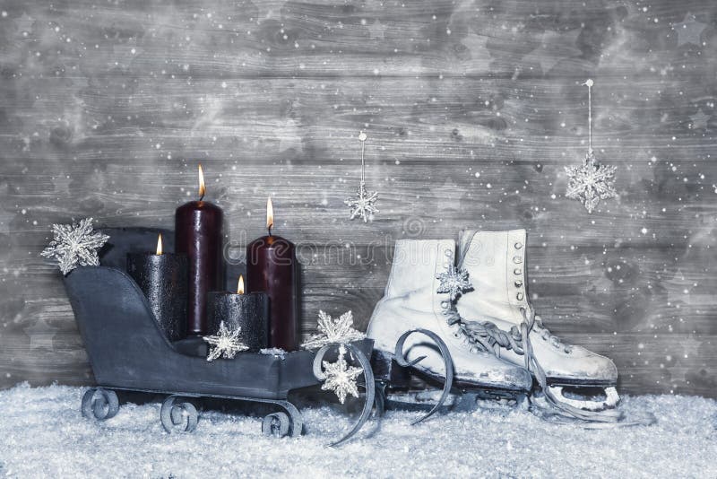 Grey shabby chic christmas background of wood with four burning candles in white and grey. Grey shabby chic christmas background of wood with four burning candles in white and grey.