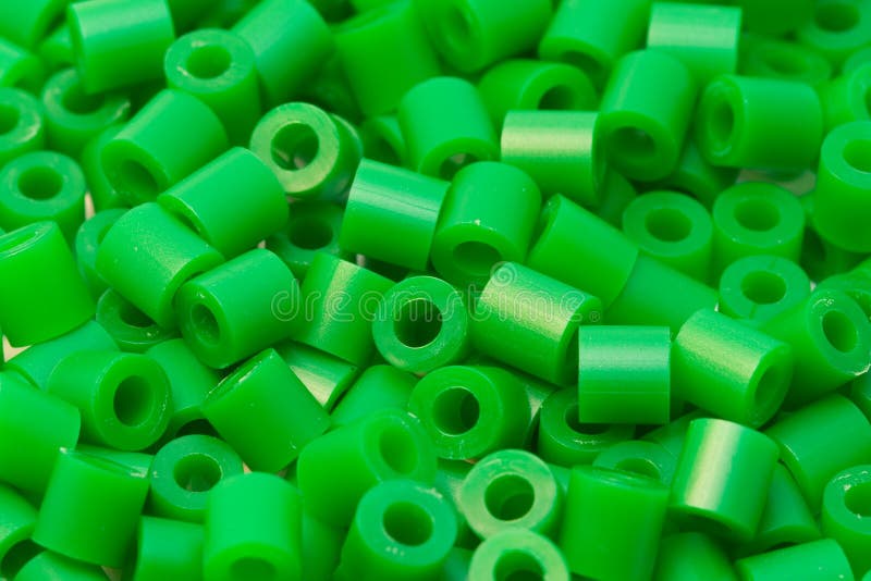Grön plast- för pärlor arkivbild