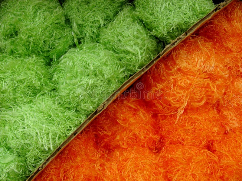 grönt orange garn för bakgrund arkivfoton grönt orange garn för bakgrund arkivfoton