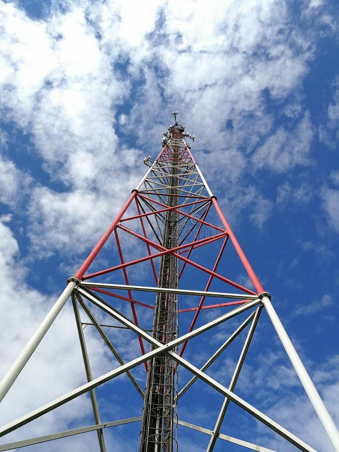 GSM Repeater Tower in Front of Blue Cloudy Sky Stock Photo Image of electronics, architecture