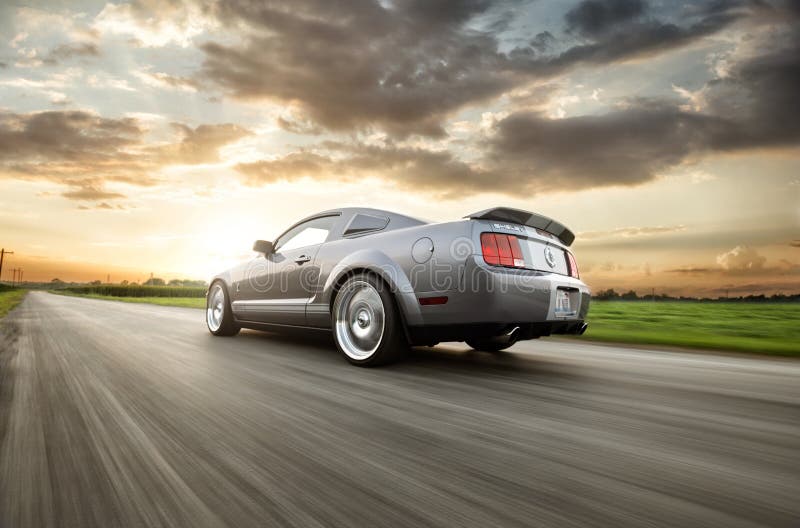 Shelby GT500 racing down a road. Shelby GT500 racing down a road