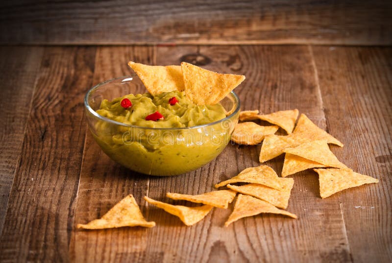 Guacamole and nacho chips. stock photo. Image of pimento 81740676
