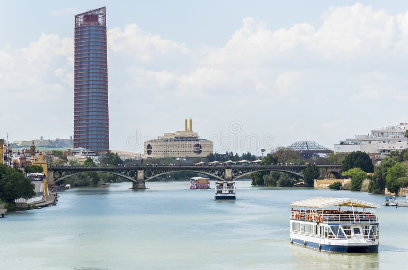 Guadalquivir river, Seville Tower, Triana bridge, Seville, Spain royalty free stock photos Guadalquivir river, Seville Tower, Triana bridge, Seville, Spain royalty free stock photos