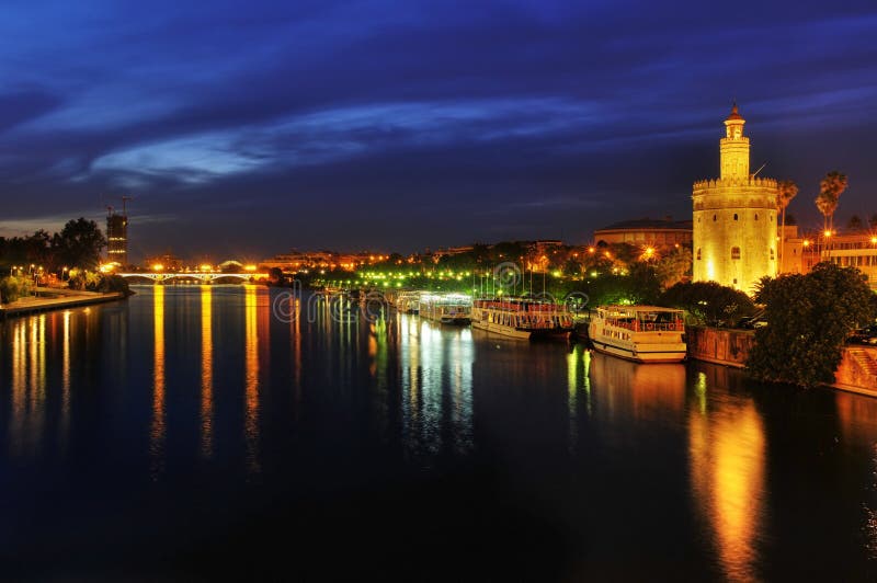 Guadalquivir River and the Torre del Oro in Sevile royalty free stock images Guadalquivir River and the Torre del Oro in Sevile royalty free stock images