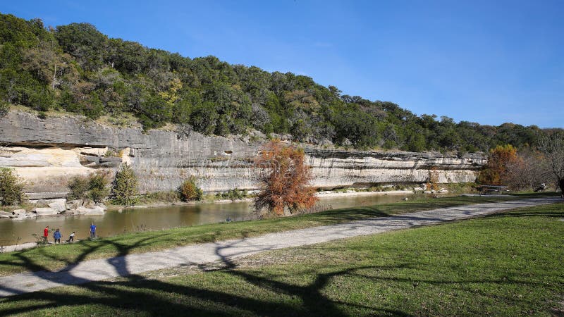 Guadalupe River runs beside a cliff in Guadalupe River State Park near San Anotonio