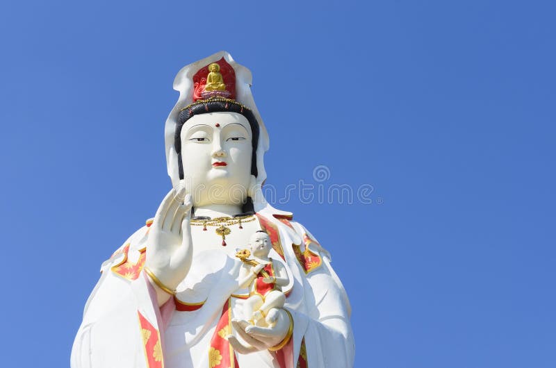Guanine Buddha statue on blue sky