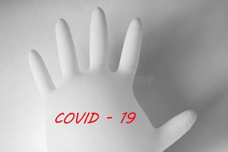 Guante médico sobre fondo blanco con el texto codificado 19. coronavirus pandémico