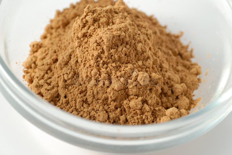 Guarana powder in a glass cup royalty free stock photos