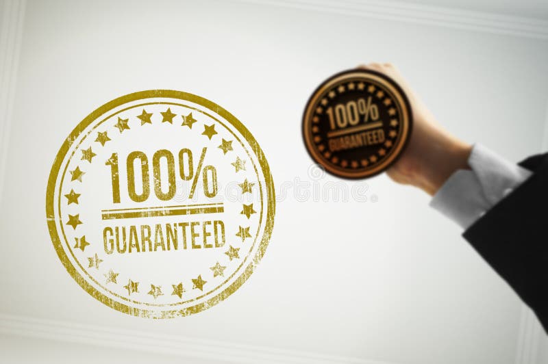 100% guaranteed rubber-stamp seen from the point of view of a sheet paper on a desk. 100% guaranteed rubber-stamp seen from the point of view of a sheet paper on a desk