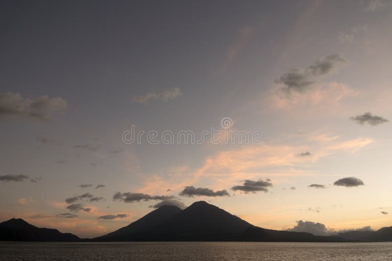 Guatemala: sunset at lake AtitlÃ¡n. Guatemala, Central America: sunset at lake AtitlÃ¡n Atitlan with volcanos Atitlan and Toliman