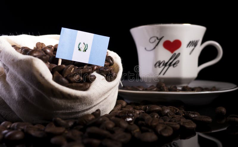Hot coffee mug with cup and coffee bean bag Stock Photo by ©singkham  138298802