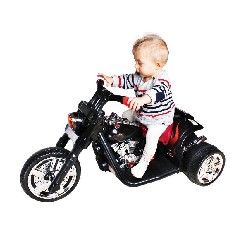 Guerreiro da estrada - bebê do bebê de um ano em uma motocicleta imagens de stock royalty free Guerreiro da estrada - bebê do bebê de um ano em uma motocicleta imagens de stock royalty free