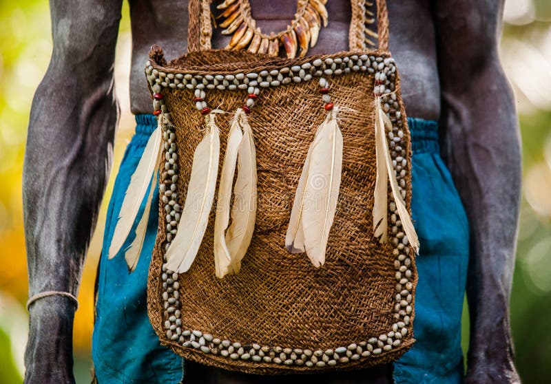 INDONESIA, IRIAN JAYA, ASMAT PROVINCE, JOW VILLAGE - JUNE 12: Traditional bag Asmat tribe warrior. INDONESIA, IRIAN JAYA, ASMAT PROVINCE, JOW VILLAGE - JUNE 12: Traditional bag Asmat tribe warrior.