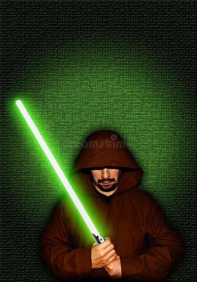 Guerriero Jedi con una sciabola da luce verde immagini stock Guerriero Jedi con una sciabola da luce verde immagini stock