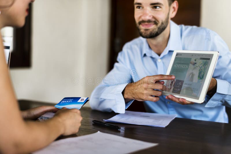 Guest booking a tour at a hotel stock image