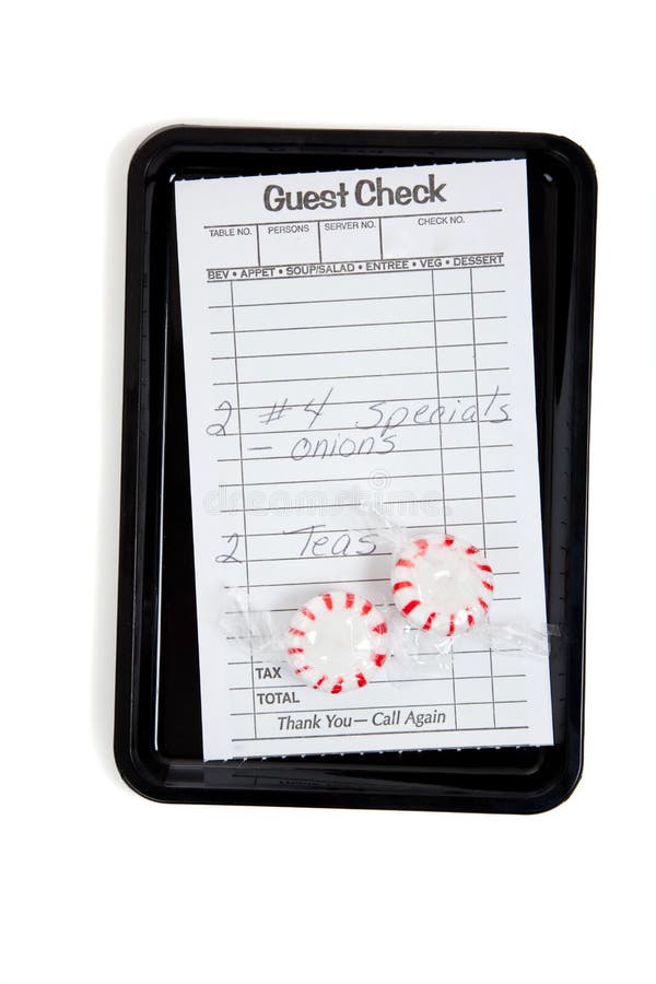 A Guest Check On A Tip Tray With Mints On White Stock Image Image of