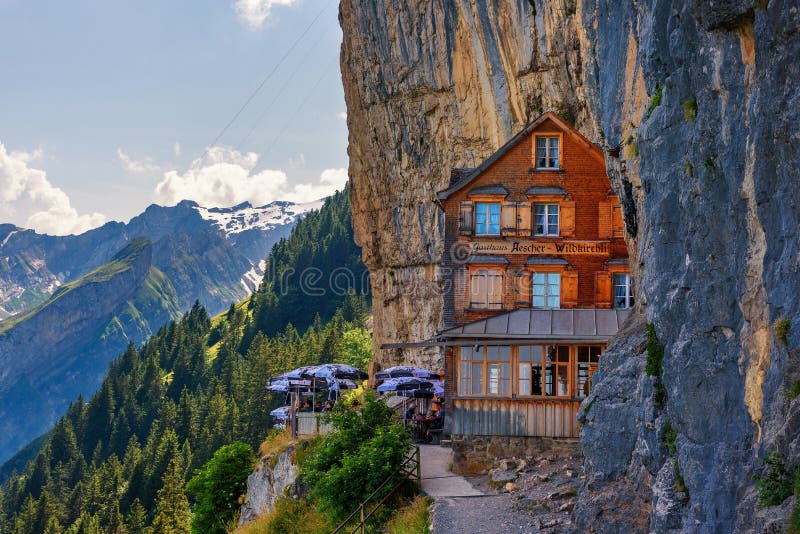 Guest house Aescher-Wildkirchli under a cliff on mountain Ebenalp in Switzerland royalty free stock photo Guest house Aescher-Wildkirchli under a cliff on mountain Ebenalp in Switzerland royalty free stock photo